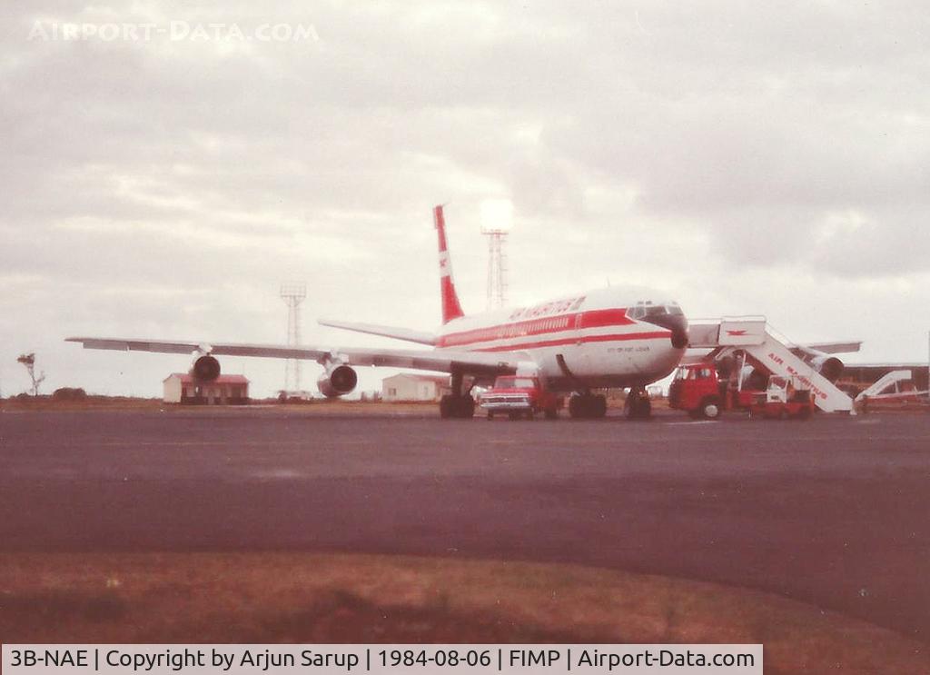 3B-NAE, 1965 Boeing 707-344B C/N 18891, 'City of Port Louis' on the apron at Plaisance during a winter evening in August 1984. Scanned from a print.