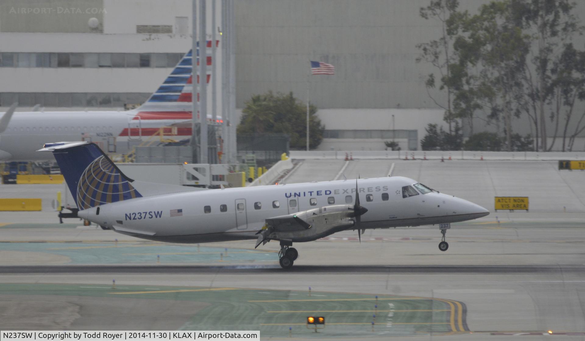 N237SW, 1996 Embraer EMB-120ER Brasilia C/N 120314, Landing at LAX on 7L