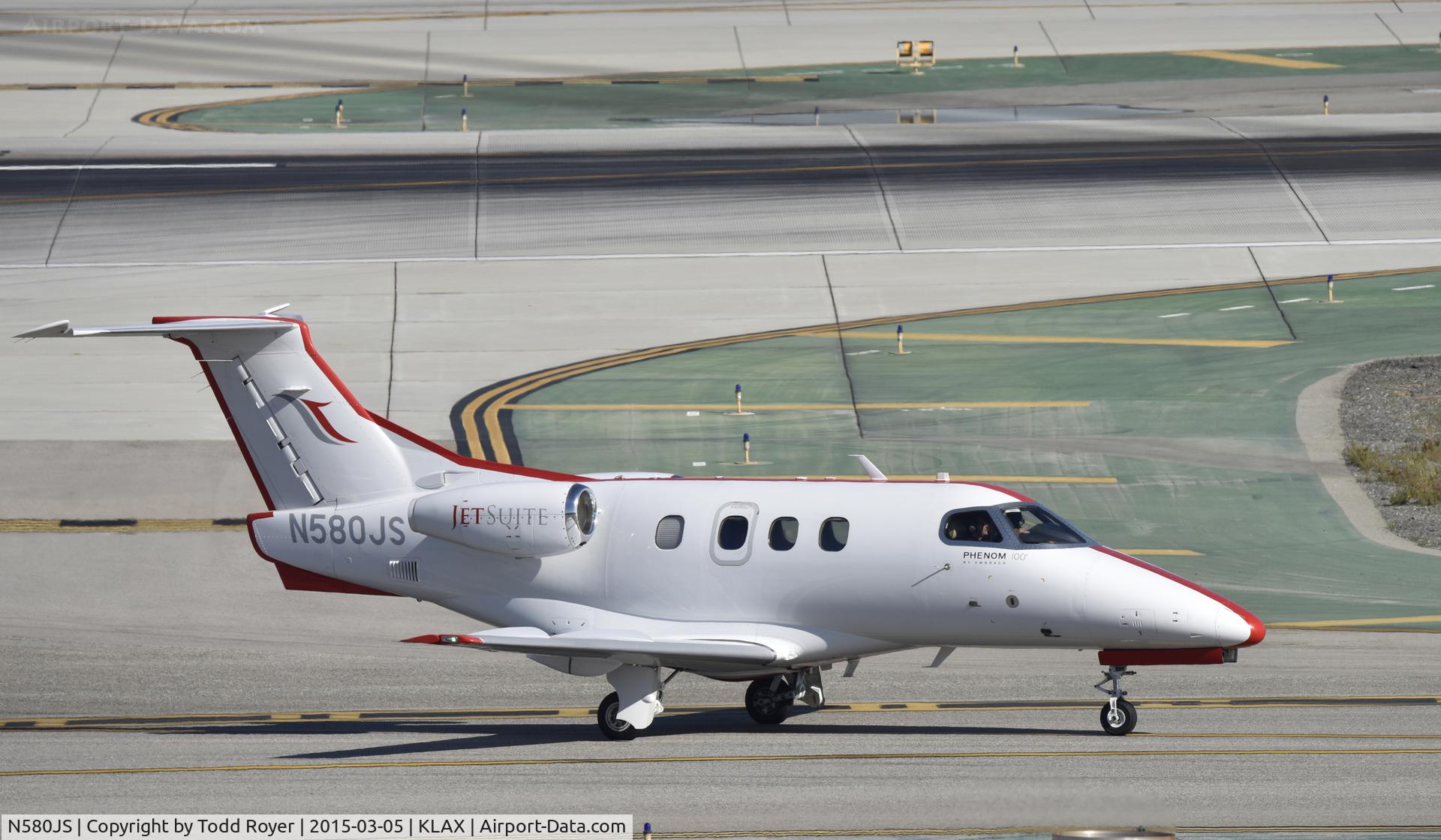 N580JS, 2009 Embraer EMB-500 Phenom 100 C/N 50000079, Taxiing to parking at LAX