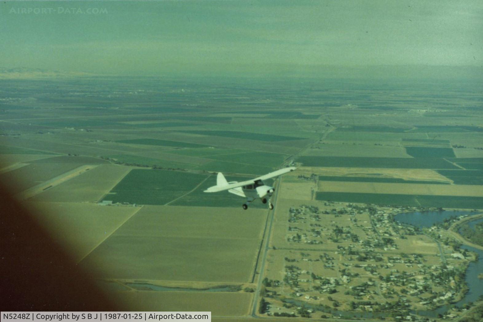N5248Z, 1961 Piper PA-22-108 Colt C/N 22-8931, 48Z over the Calif central valley with 1Q4 on the left and the San Joaquin river on the right. View is to the north.