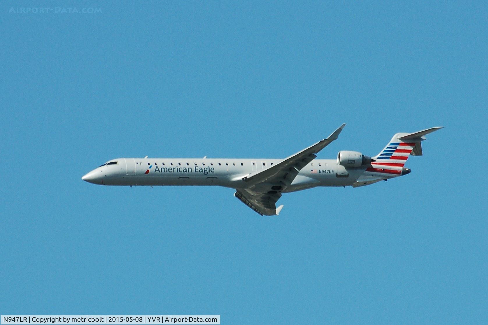 N947LR, 2007 Bombardier CRJ-900 (CL-600-2D24) C/N 15116, Flaps down,gear still up,AA5249 arrives from LAX