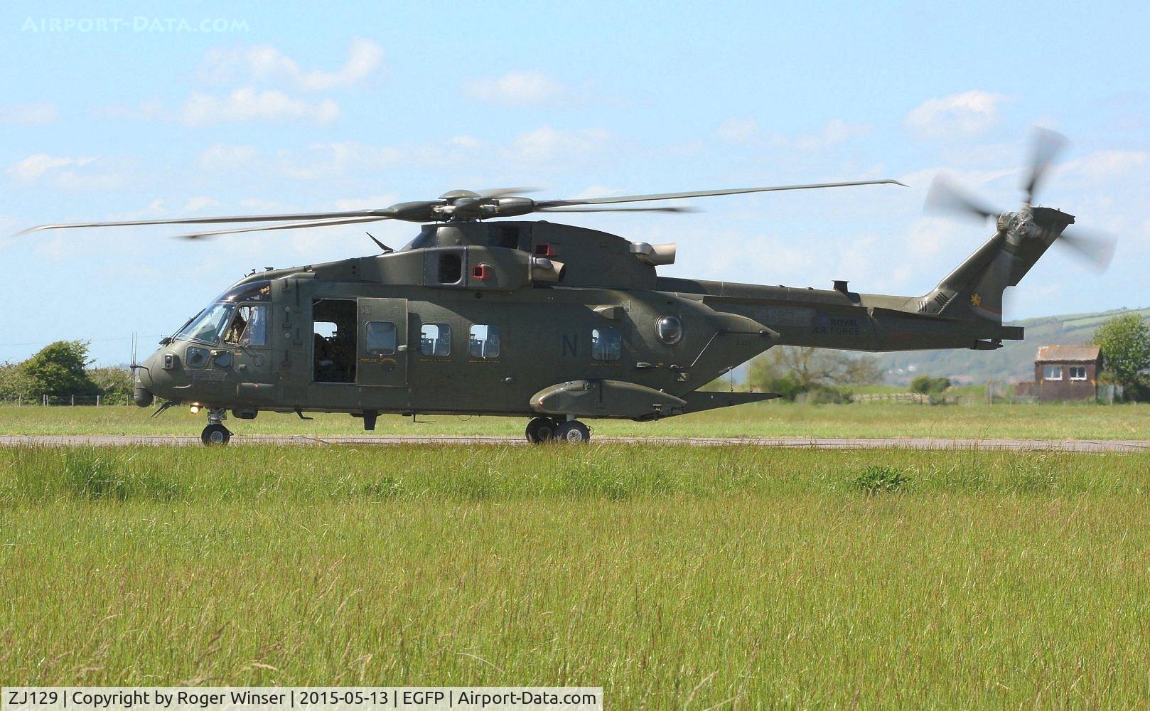 ZJ129, Westland Merlin HC.4 C/N 50167/RAF13, Visiting RN Merlin helicopter coded N of 846 NAS. Still carrying the badge of the disbanded 78 Squadron RAF on the port side of the boom.