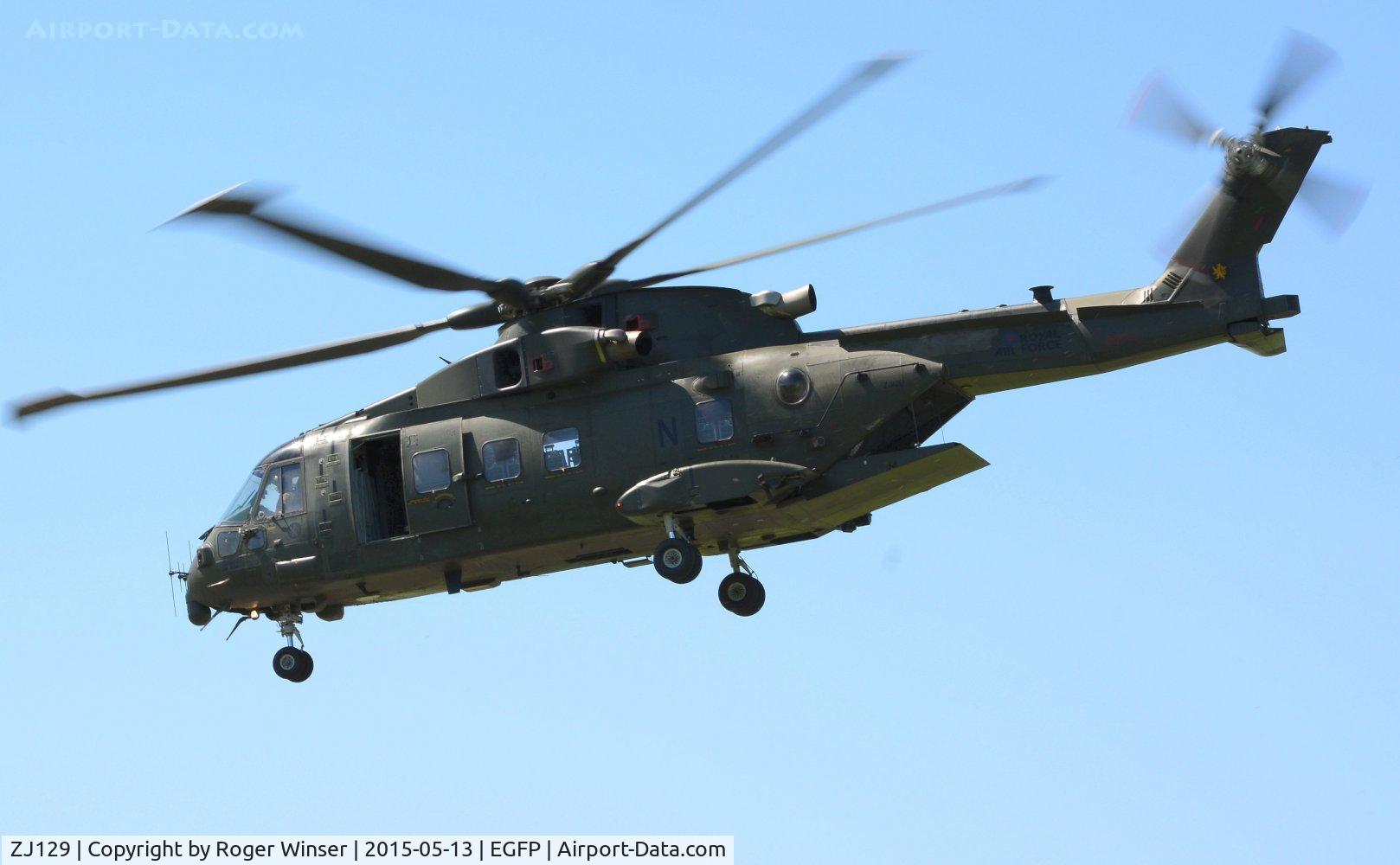 ZJ129, Westland Merlin HC.4 C/N 50167/RAF13, Visiting RN Merlin helicopter coded N of 846 NAS departing the airport after taking on fuel. The helicopter still carries the badge of the disbanded 78 Squadron RAF on the port side of the boom. 