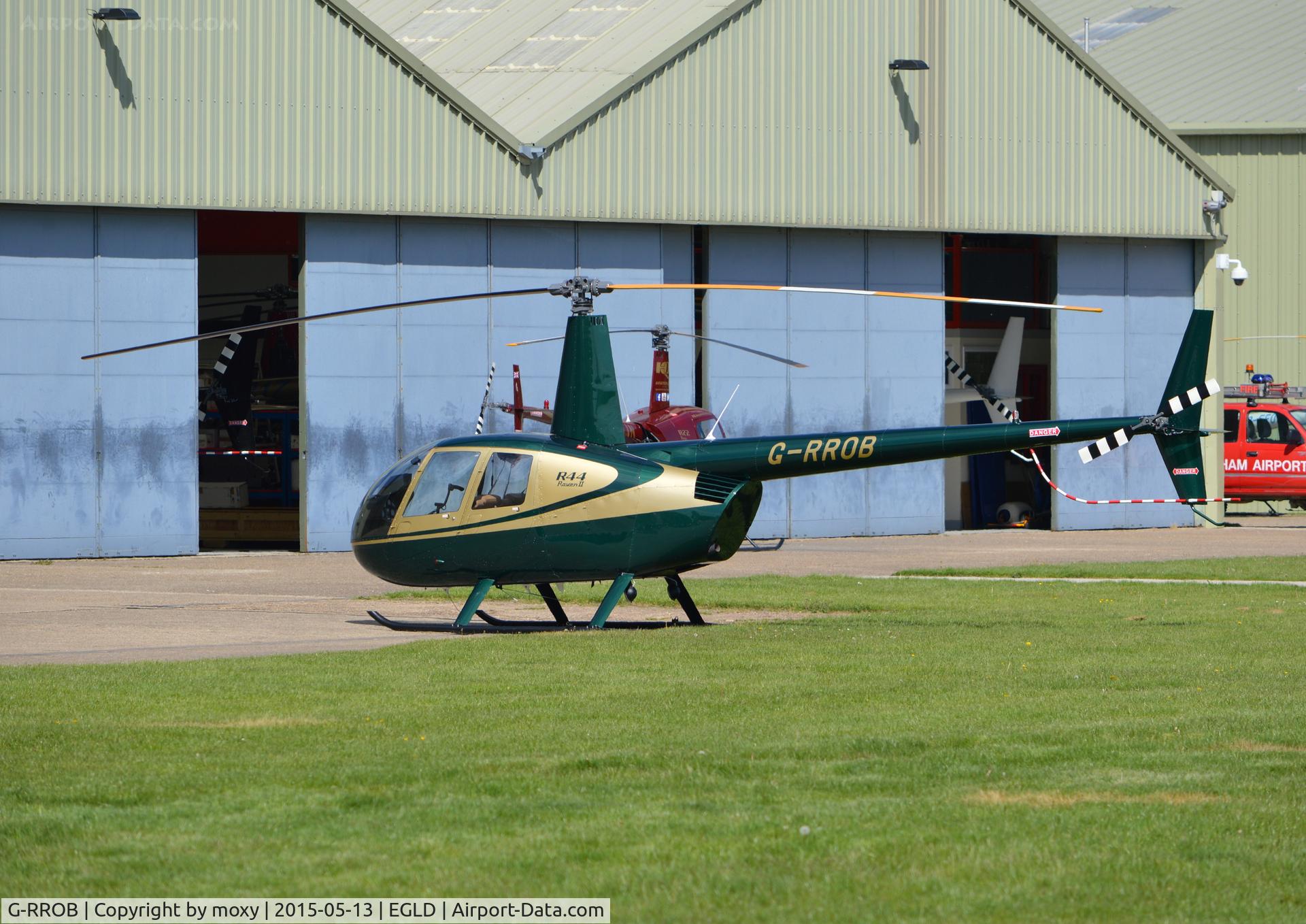 G-RROB, 2002 Robinson R44 II C/N 10011, Robinson R44 at Denham.