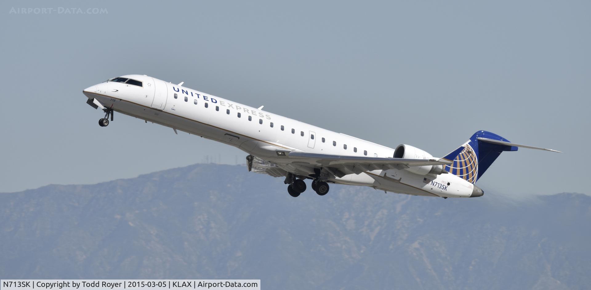 N713SK, 2004 Bombardier CRJ-701ER (CL-600-2C10) Regional Jet C/N 10174, Departing LAX