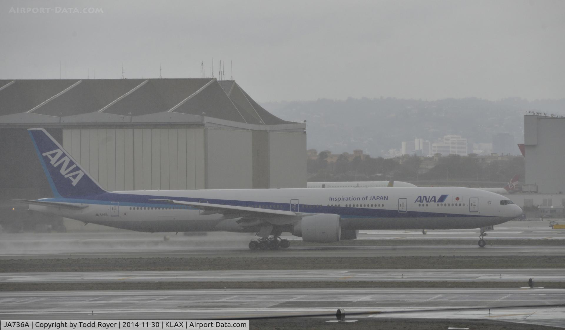 JA736A, 2006 Boeing 777-381/ER C/N 34893, Departing LAX in the rain