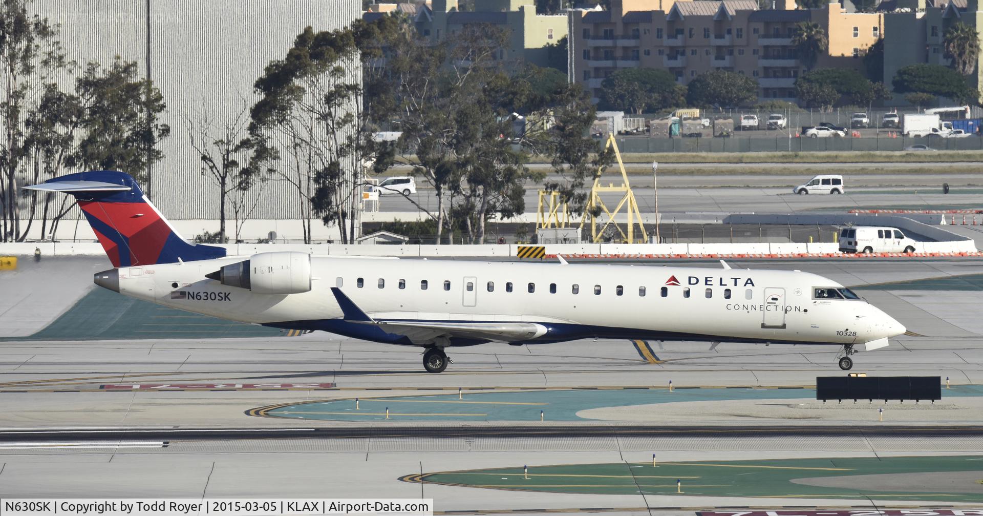 N630SK, 2011 Bombardier CRJ-700 (CL-600-2C10) Regional Jet C/N 10328, Taxiing to gate at LAX