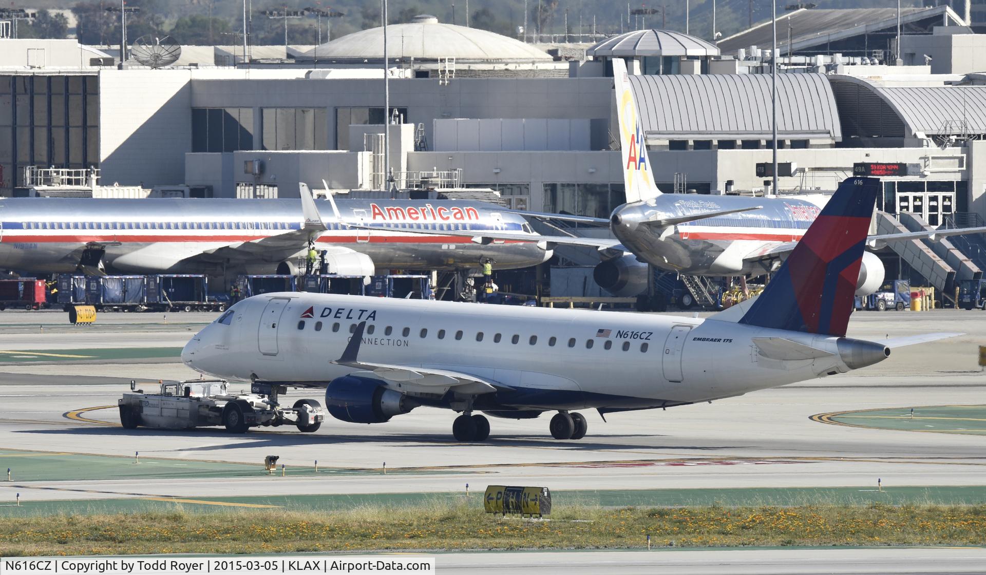N616CZ, 2008 Embraer 175LR (ERJ-170-200LR) C/N 17000209, Getting towed to gate