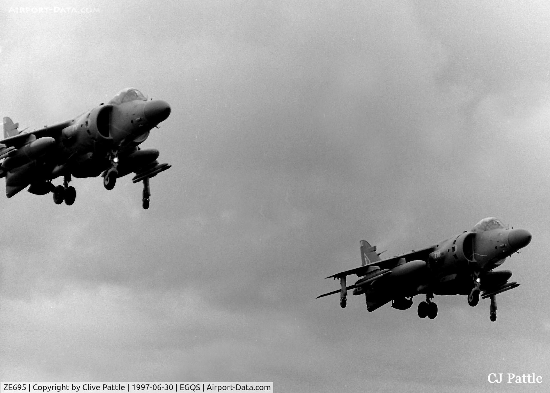 ZE695, 1987 British Aerospace Sea Harrier F/A.2 C/N B54, Dual takeoff at RAF Lossiemouth EGQS with ZE695 coded 718/VL (right) and ZD608 coded 717/VL, both from the FAA 899 NAS. Scanned from an old negative and desaturated on photoshop to B/W because of colour problems