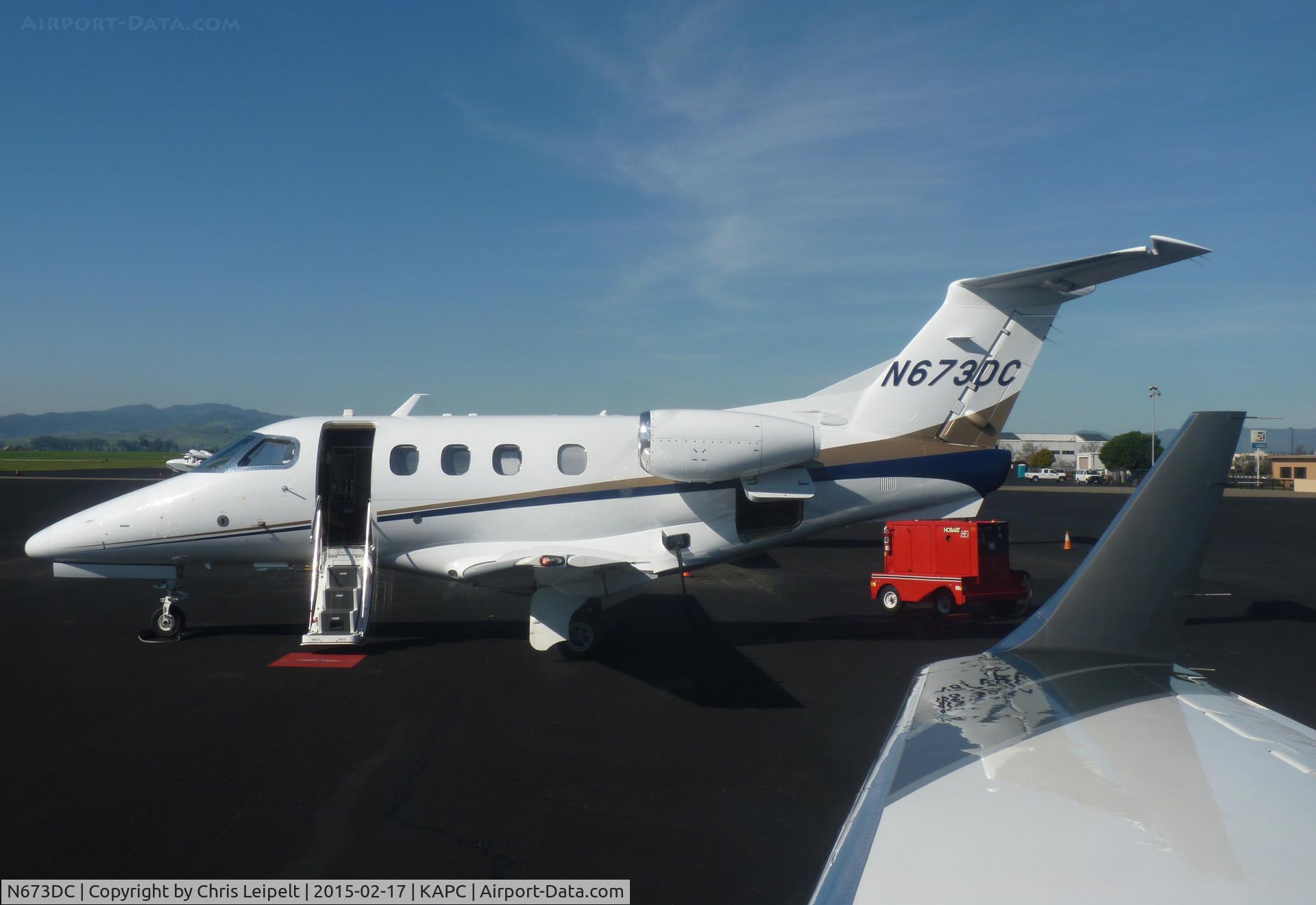 N673DC, 2008 Embraer EMB-500 Phenom 100 C/N 50000010, An Embraer Phenom 300 sitting at the Napa Jet Center ramp. Photo taken inside N438FX, a LearJet 45.