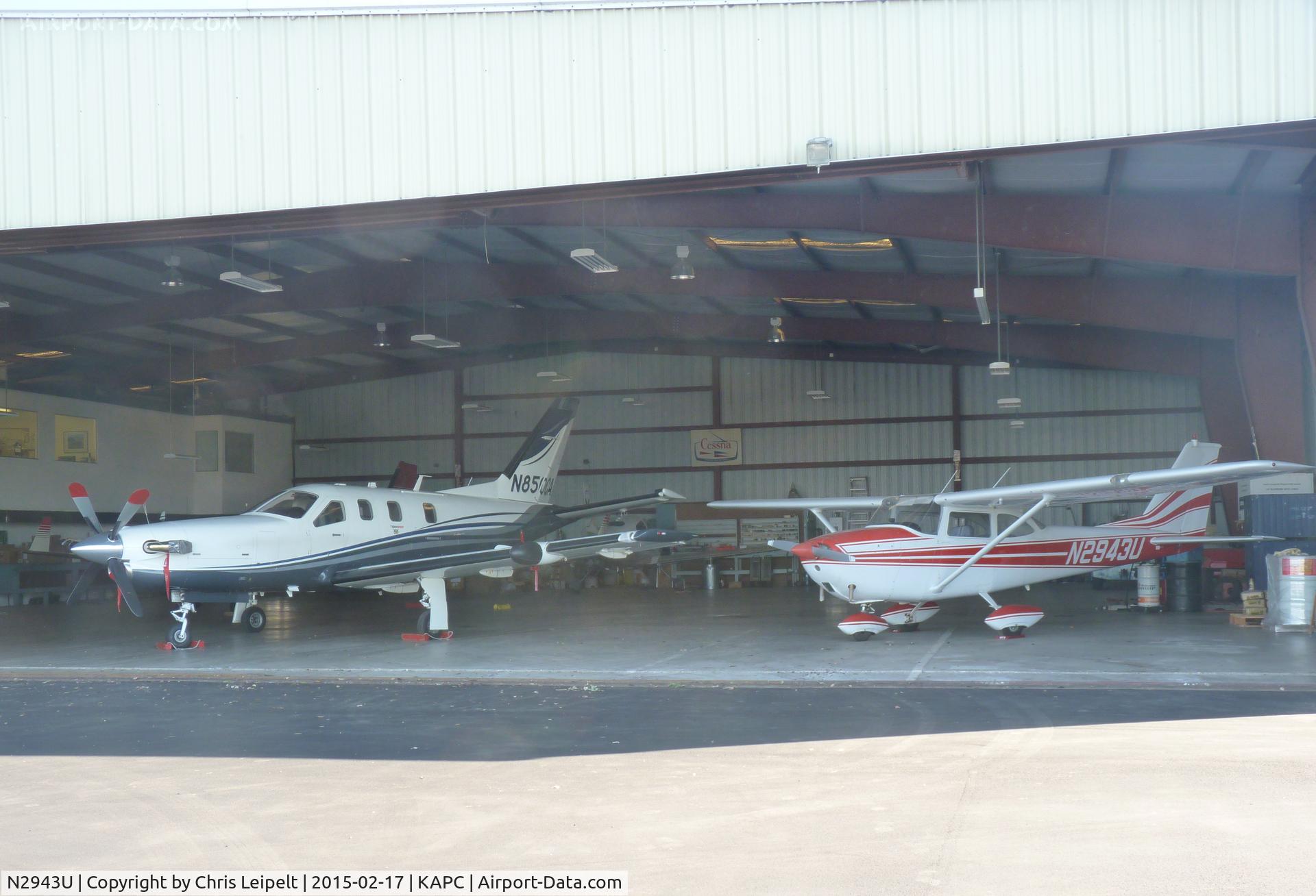 N2943U, 1963 Cessna 172D C/N 17250543, A 1963 Cessna 172D sitting inside a hangar next to a local TBM 850 at Napa Airport, CA.