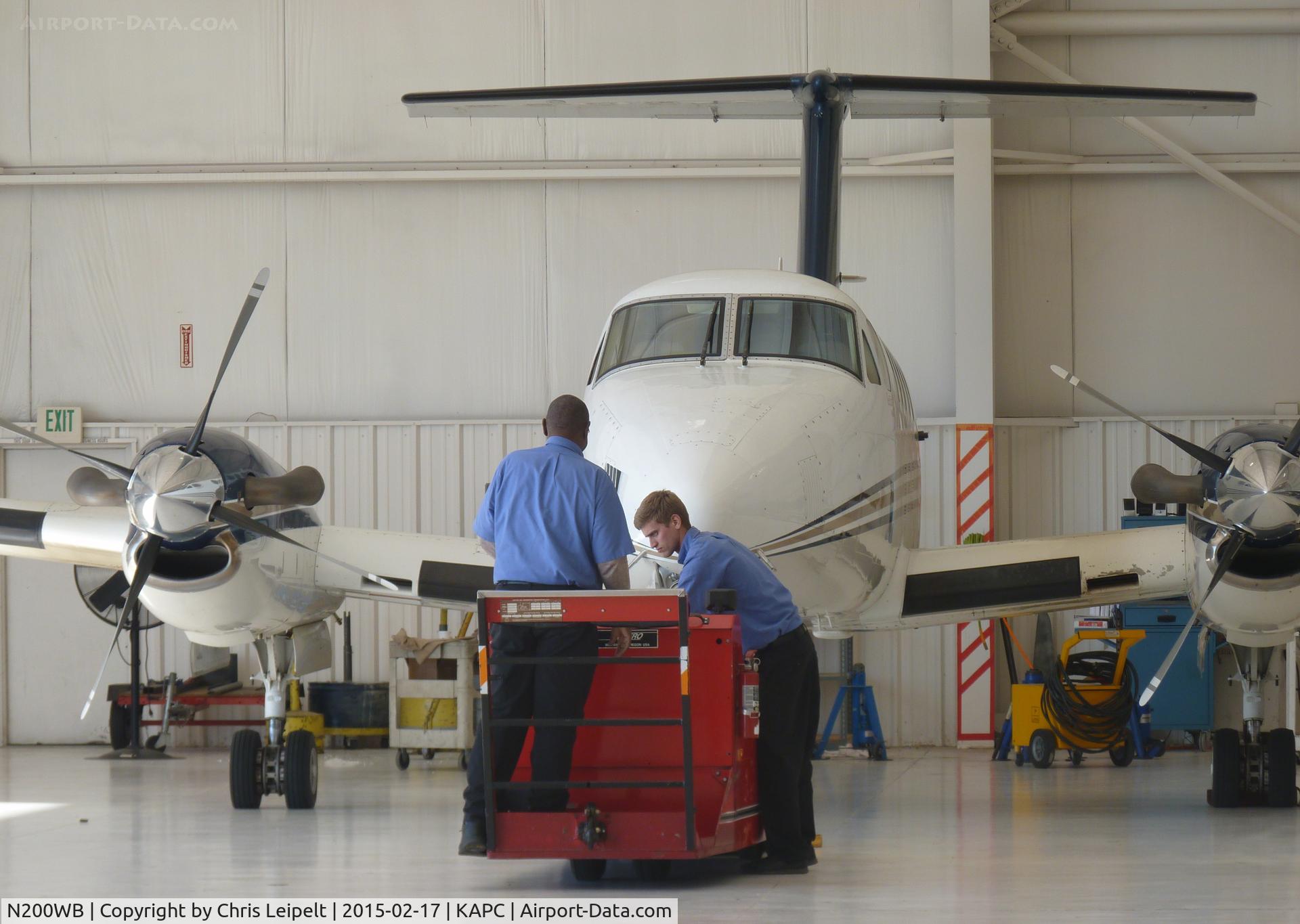 N200WB, 2001 Raytheon B200 King Air C/N BB-1754, The ground crew pulling out a beautiful 2001 King Air B200 from its hangar to go out to the run up area to test some buttons.