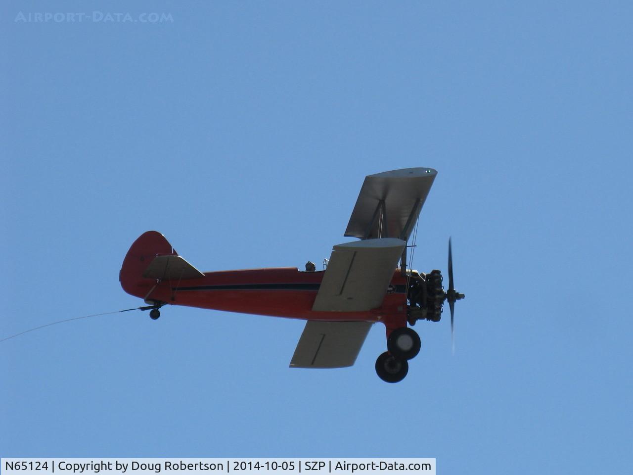 N65124, 1943 Boeing A75N1(PT17) C/N 75-1260, Banner Tow sequence by N65124 Boeing Stearman, banner drop on 22L and fly away. Note towline. End of sequence photo.