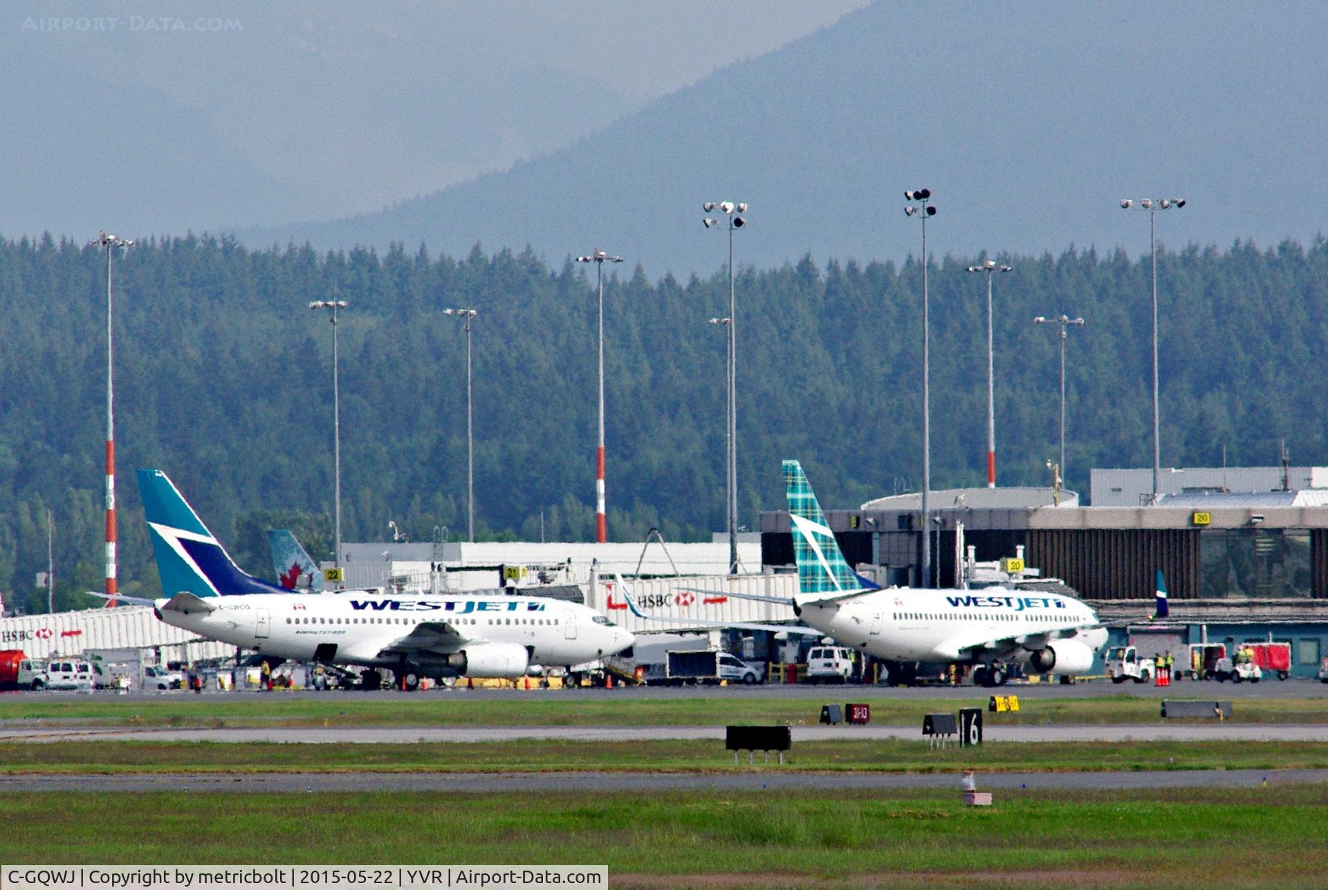 C-GQWJ, 2007 Boeing 737-7CT C/N 35505, Two of a kind(or Birds of a feather) at the Gate.
