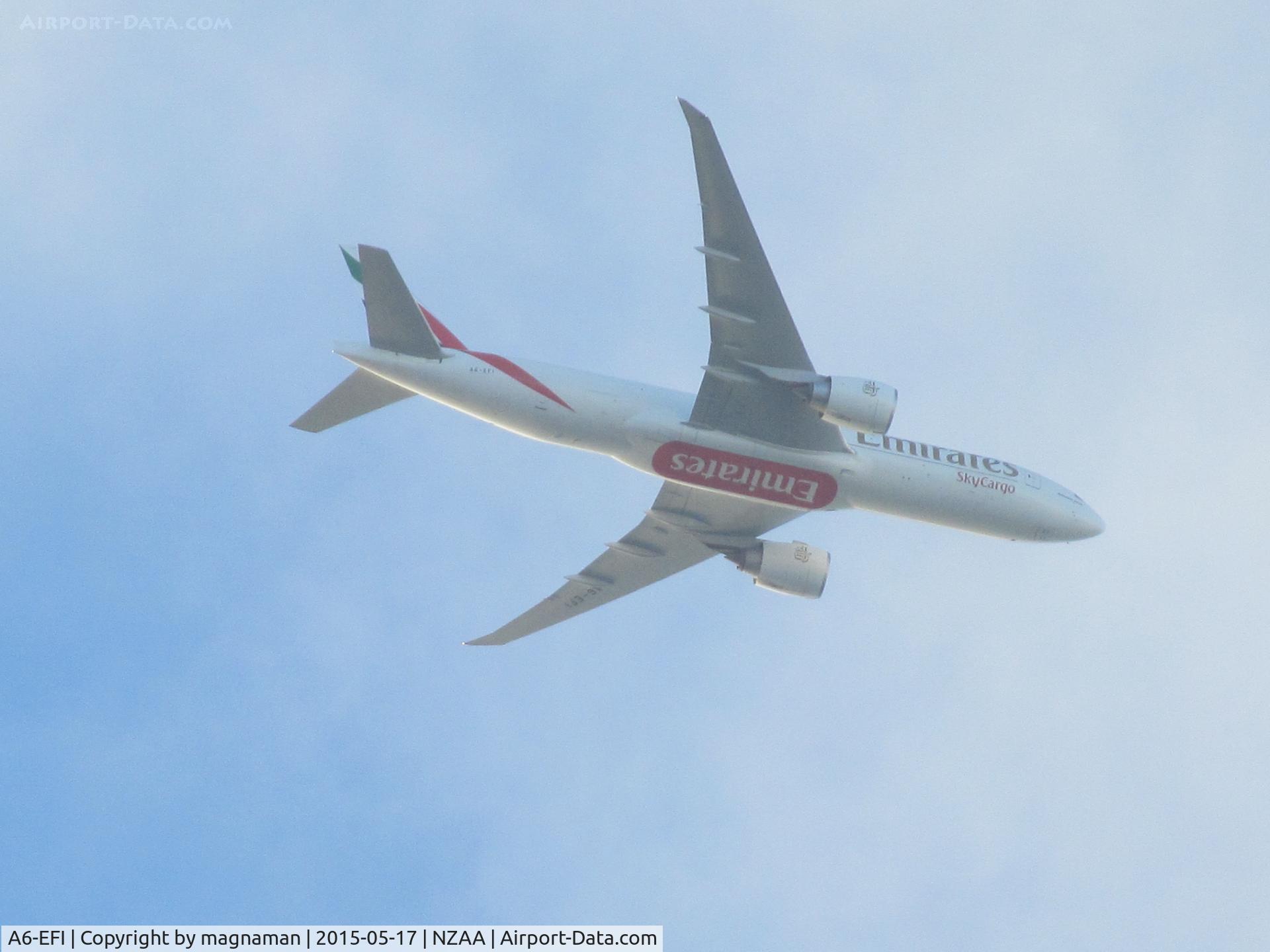 A6-EFI, 2012 Boeing 777-F1H C/N 35609, overhead mellons bay on way into AKL