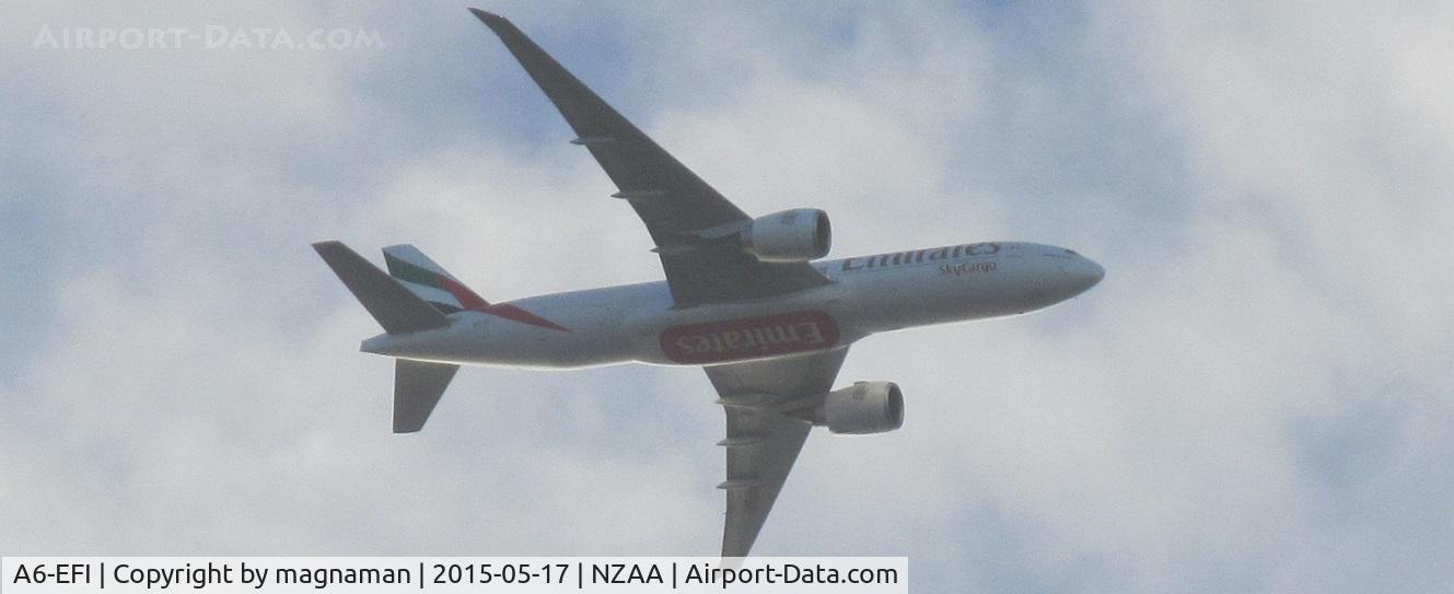 A6-EFI, 2012 Boeing 777-F1H C/N 35609, approaching over head Mellons Bay on base leg into NZAA
