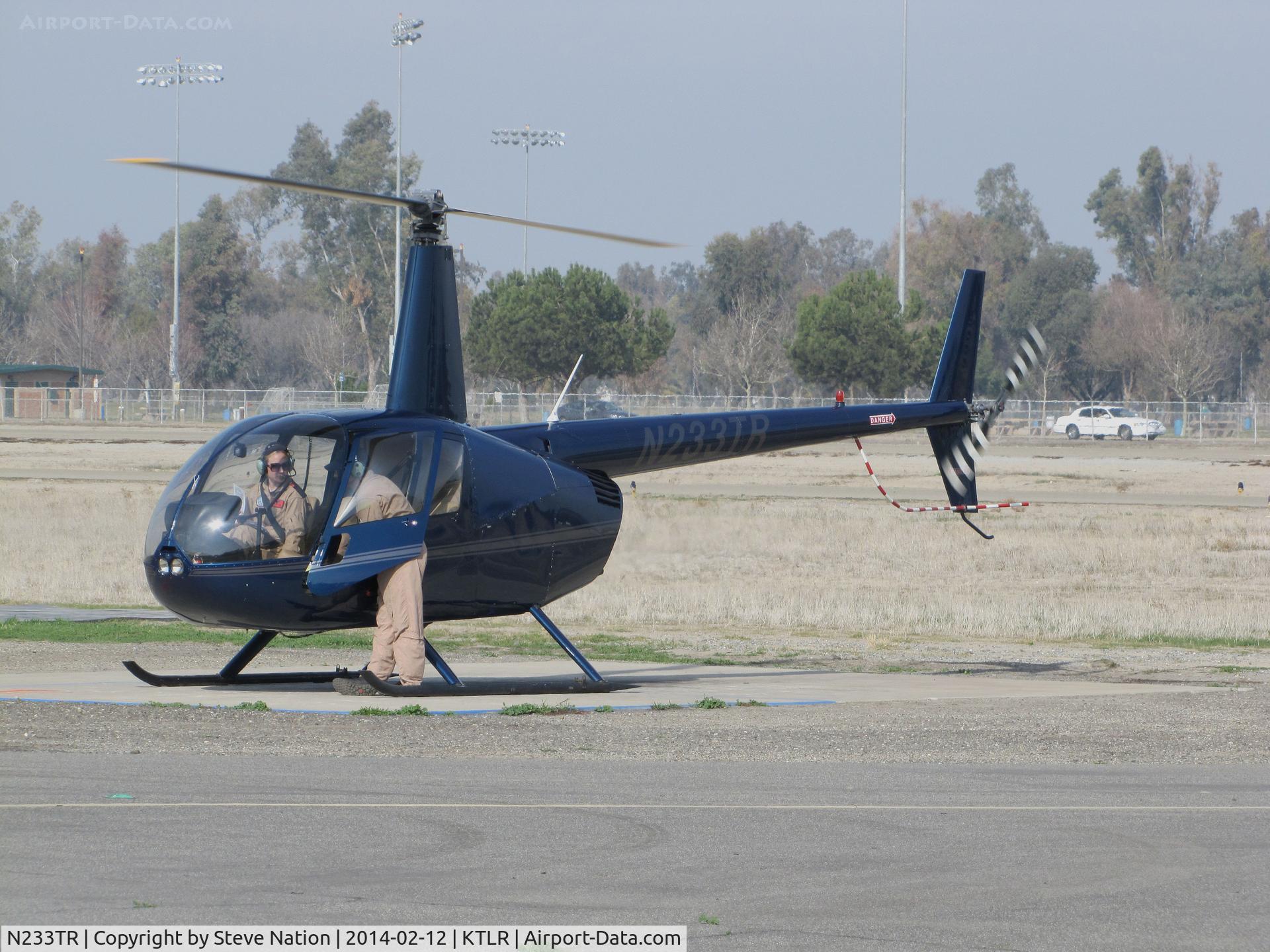 N233TR, 2003 Robinson R44 Raven II C/N 10062, Sierra Flite Robinson R44 II @ Mefford Field (Tulare, CA) for helicopter rides over the 2014 International Ag Expo
