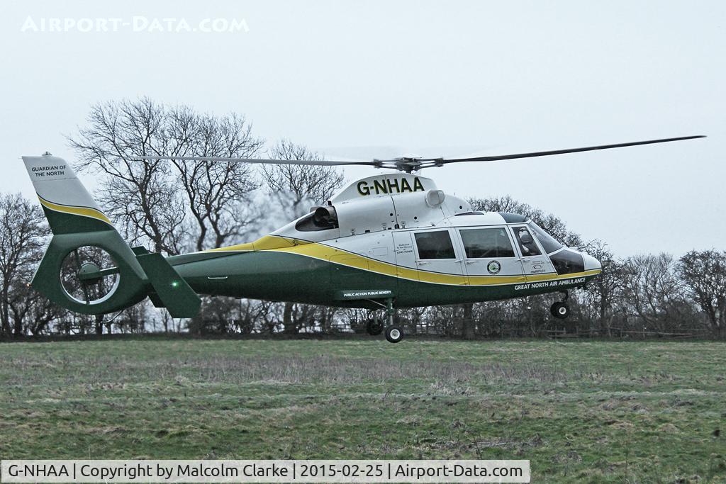 G-NHAA, 1991 Aerospatiale AS-365N-2 Dauphin C/N 6431, Great North Air Ambulance Aerospatiale AS-365N-2 Dauphin on an emergency call in Sedgefield Village UK. February 25th 2015.