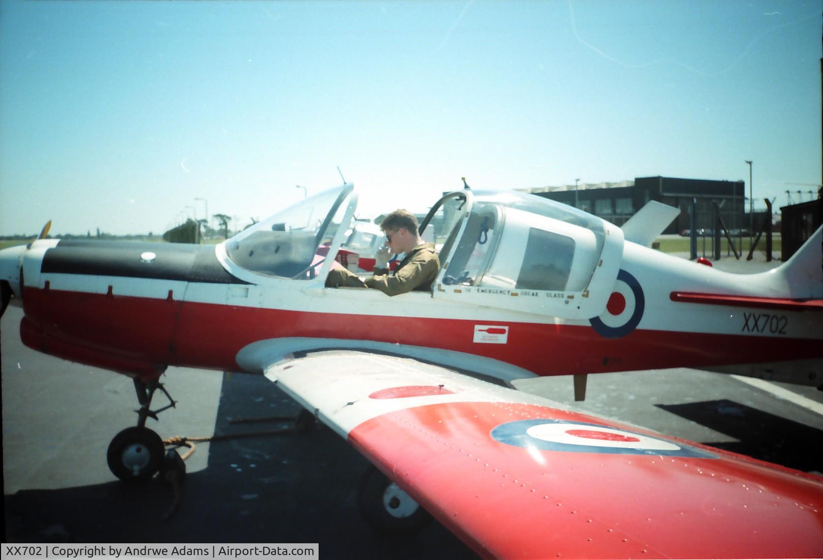 XX702, 1975 Scottish Aviation Bulldog T.1 C/N BH120/351, Al Fallon boning up on his flight checks. Taken at RAF St Mawgan Cornwall
