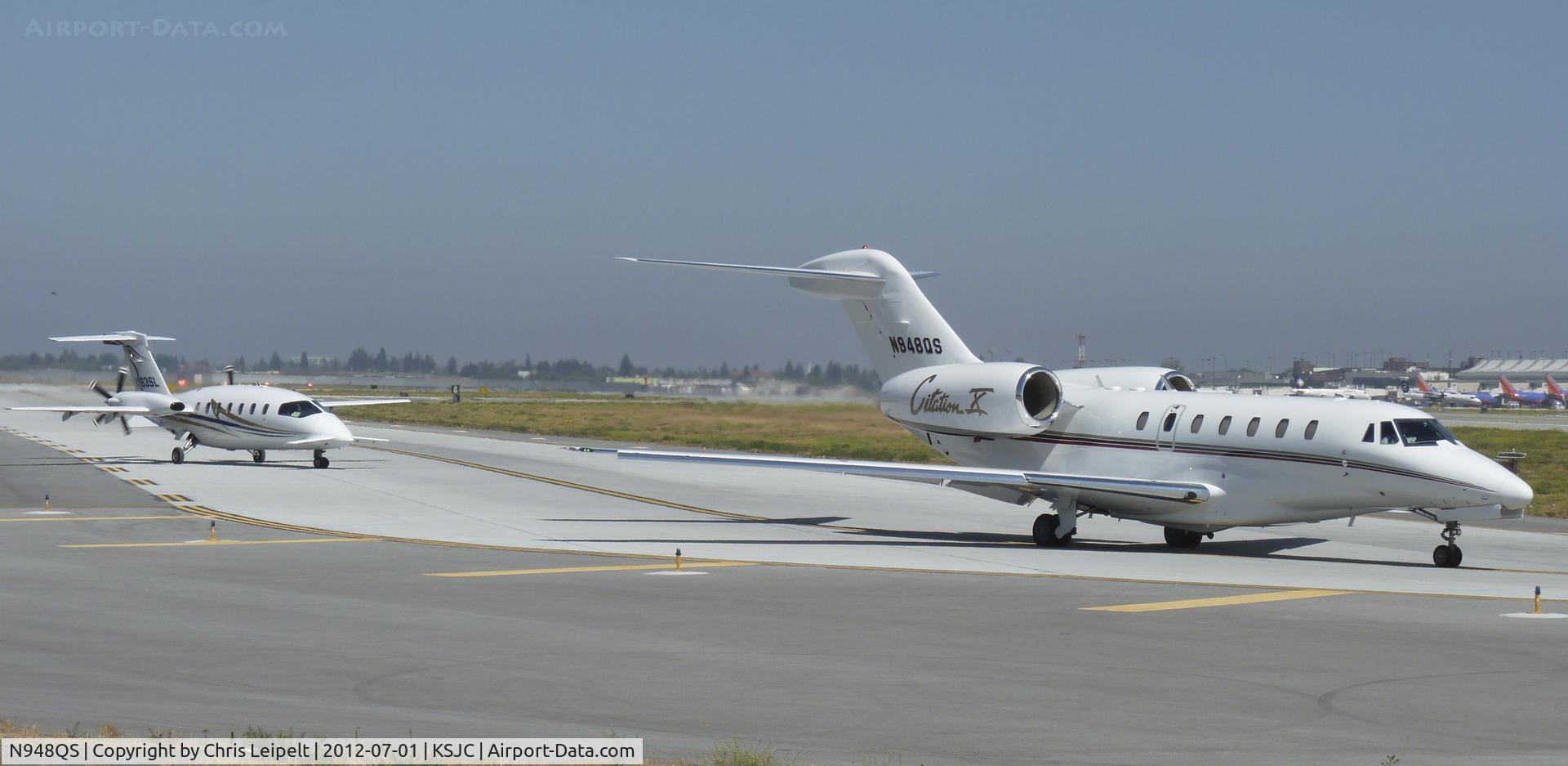 N948QS, 2001 Cessna 750 Citation X Citation X C/N 750-0149, NetJet's 2001 Cessna Citation X taxing out while a P180 taxis out behind it at San Jose International Airport, CA.