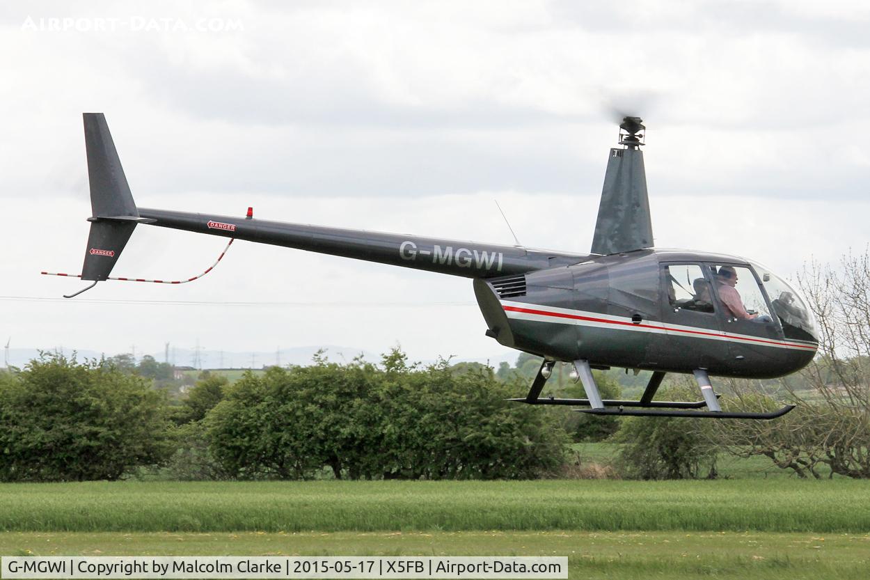 G-MGWI, 2000 Robinson R44 Astro C/N 0663, Robinson R44 Astro at the opening of Fishburn Airfield's new clubhouse, May 17th 2015.
