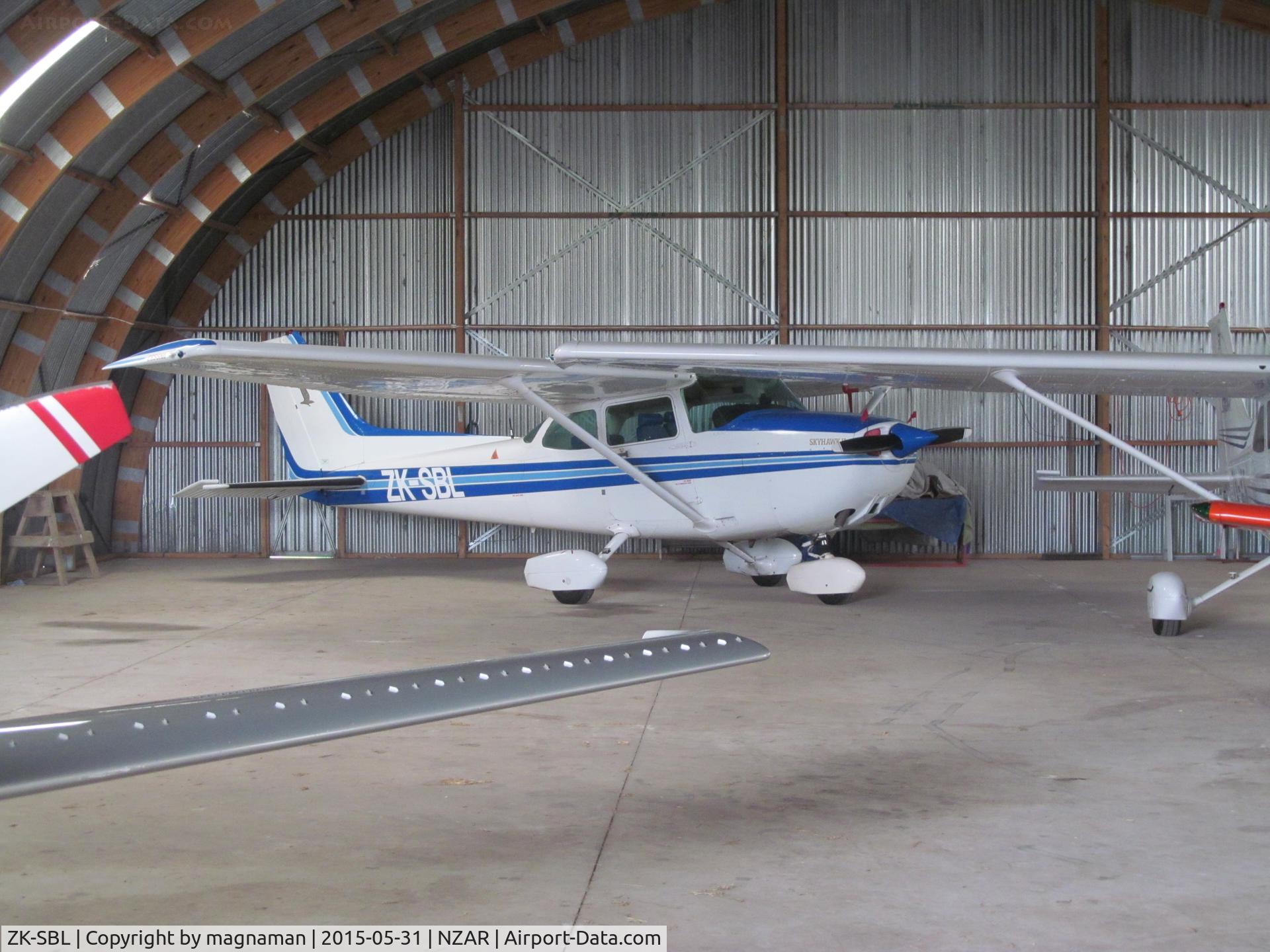 ZK-SBL, Cessna 172P C/N 17275844, safe in back of hangar