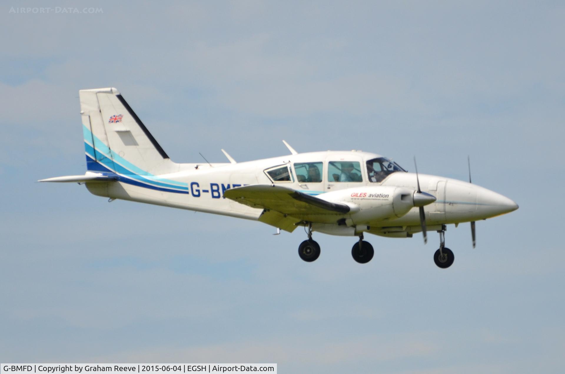 G-BMFD, 1979 Piper PA-23-250 Aztec F C/N 27-7954080, Landing at Norwich.