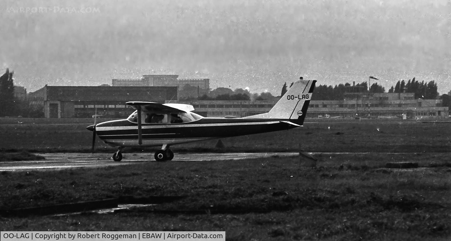 OO-LAG, 1964 Cessna 172E C/N 17251443, MID 1960's.
Airport buildings background.
