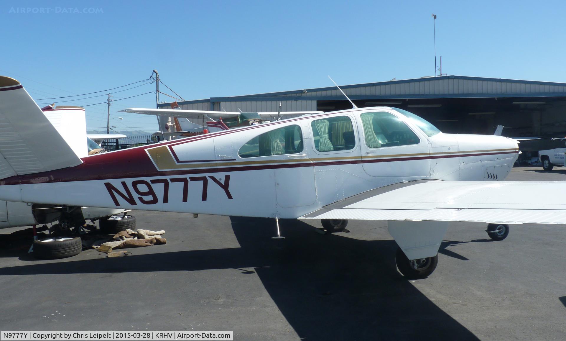 N9777Y, 1963 Beech P35 Bonanza C/N D-7160, A local 1963 Beechcraft Bonanza P35 parked near Squadron 2 for maintenance at Reid Hillview Airport, CA.