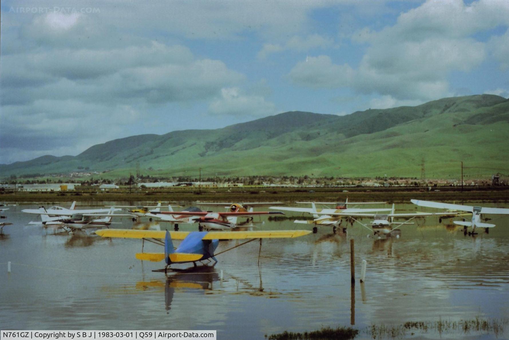 N761GZ, Cessna A152 Aerobat C/N A1520953, 1GZ (Cessna 152) seen on the left side of the yellow (Chief) wing with its feet wet during an early 80s Fremont flood.Sadly now the entire plane is under water due to a tragic accident on 6-19-94.