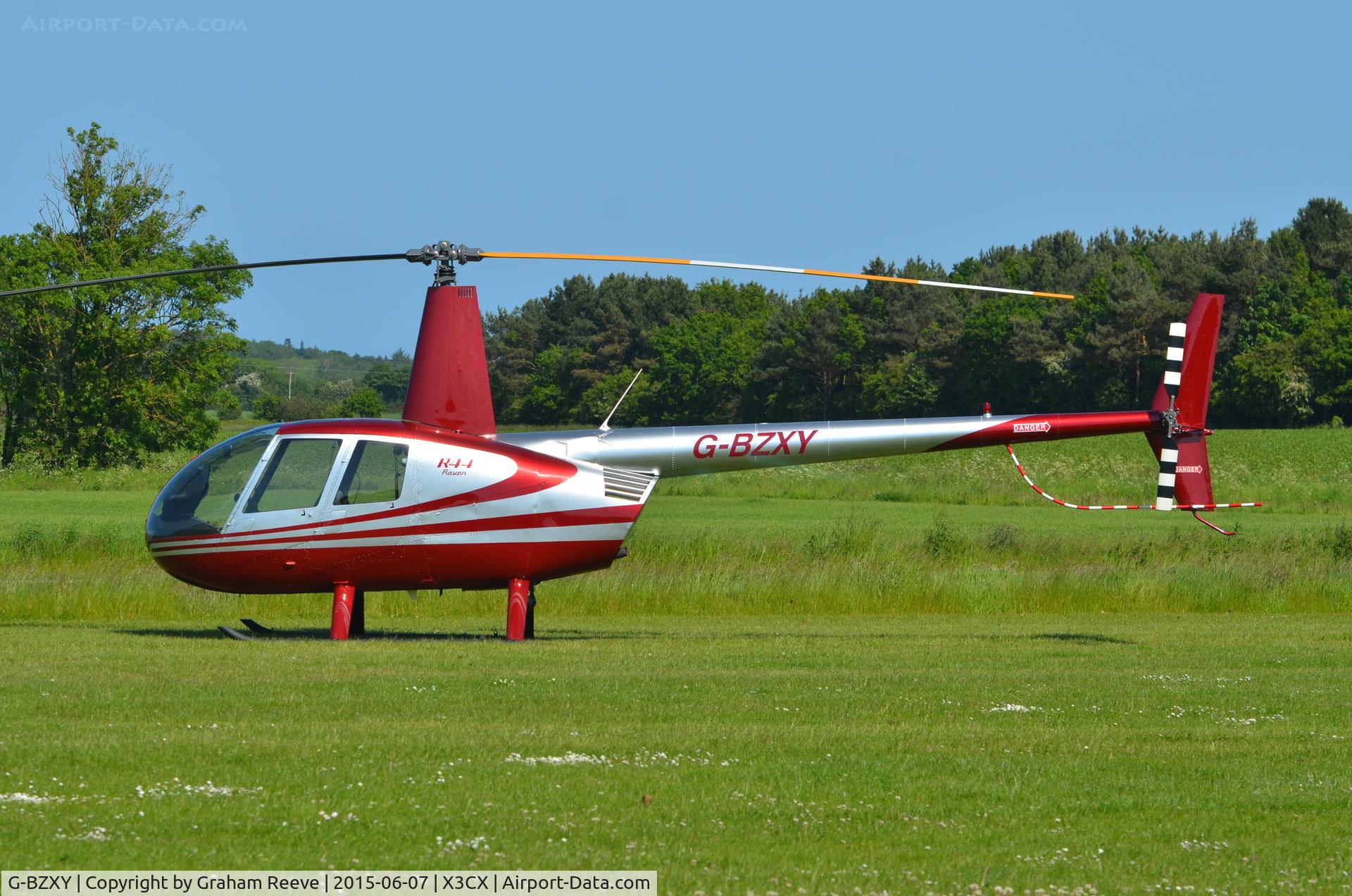 G-BZXY, 2001 Robinson R44 Raven C/N 1027, Parked at Northrepps.