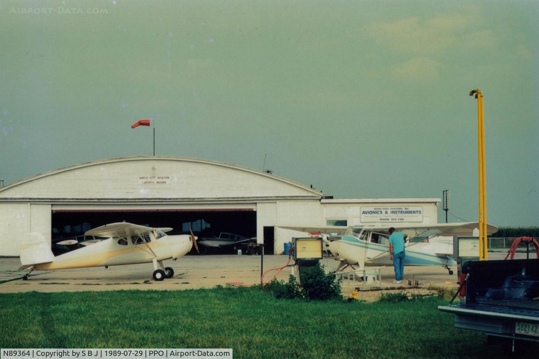 N89364, 1946 Cessna 140 C/N 8396, 364 at the fuel island (half island) in LaPorte,In. with Chief 68E.I was flying 364 on this flight and had sold 68E to Mike seen attending  68E.While both had C85s,364 was over 10 mph faster and did not like speed needed to stay with 68E.Did a lot of 360s