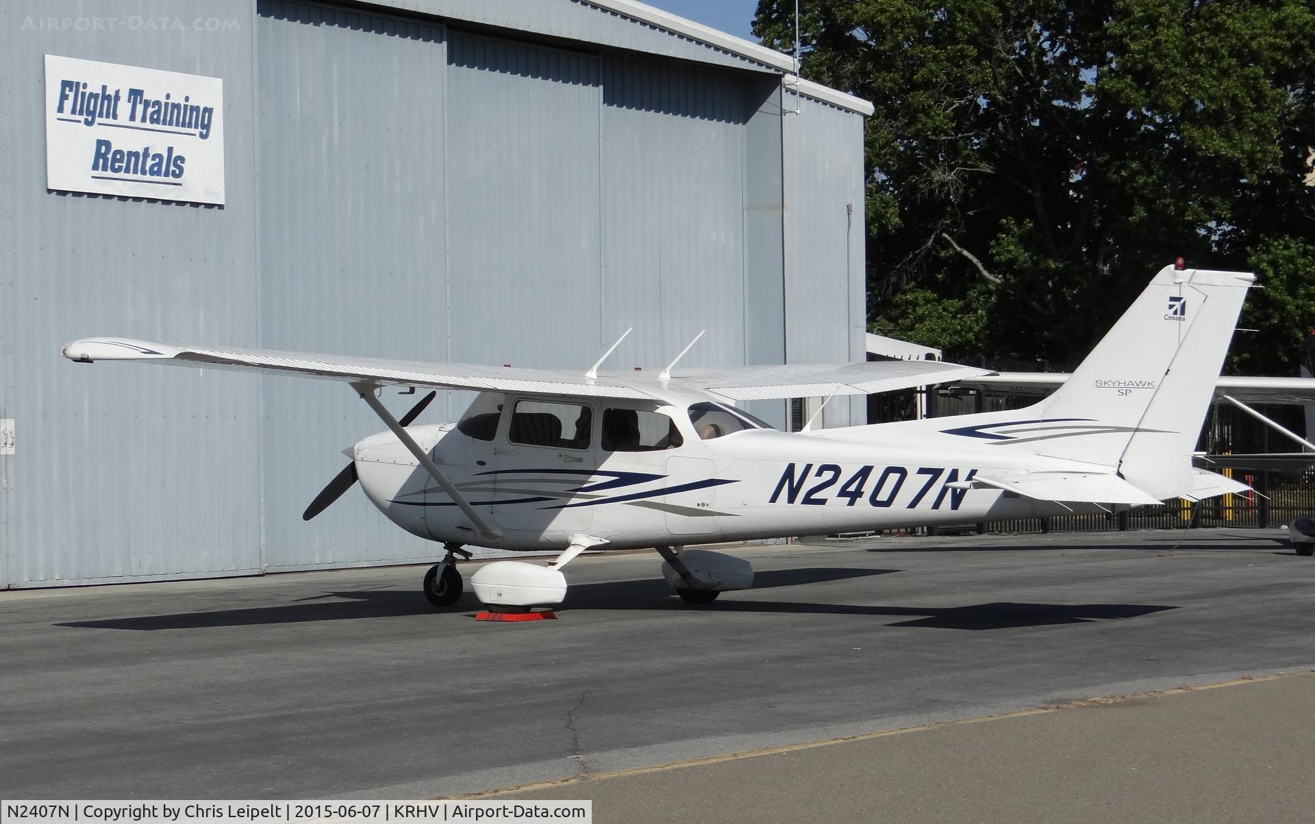 N2407N, 2007 Cessna 172S C/N 172S10550, A transient 2007 Cessna 172S parked in front of the Trade Winds Aviation hangar at Reid Hillview Airport, CA.