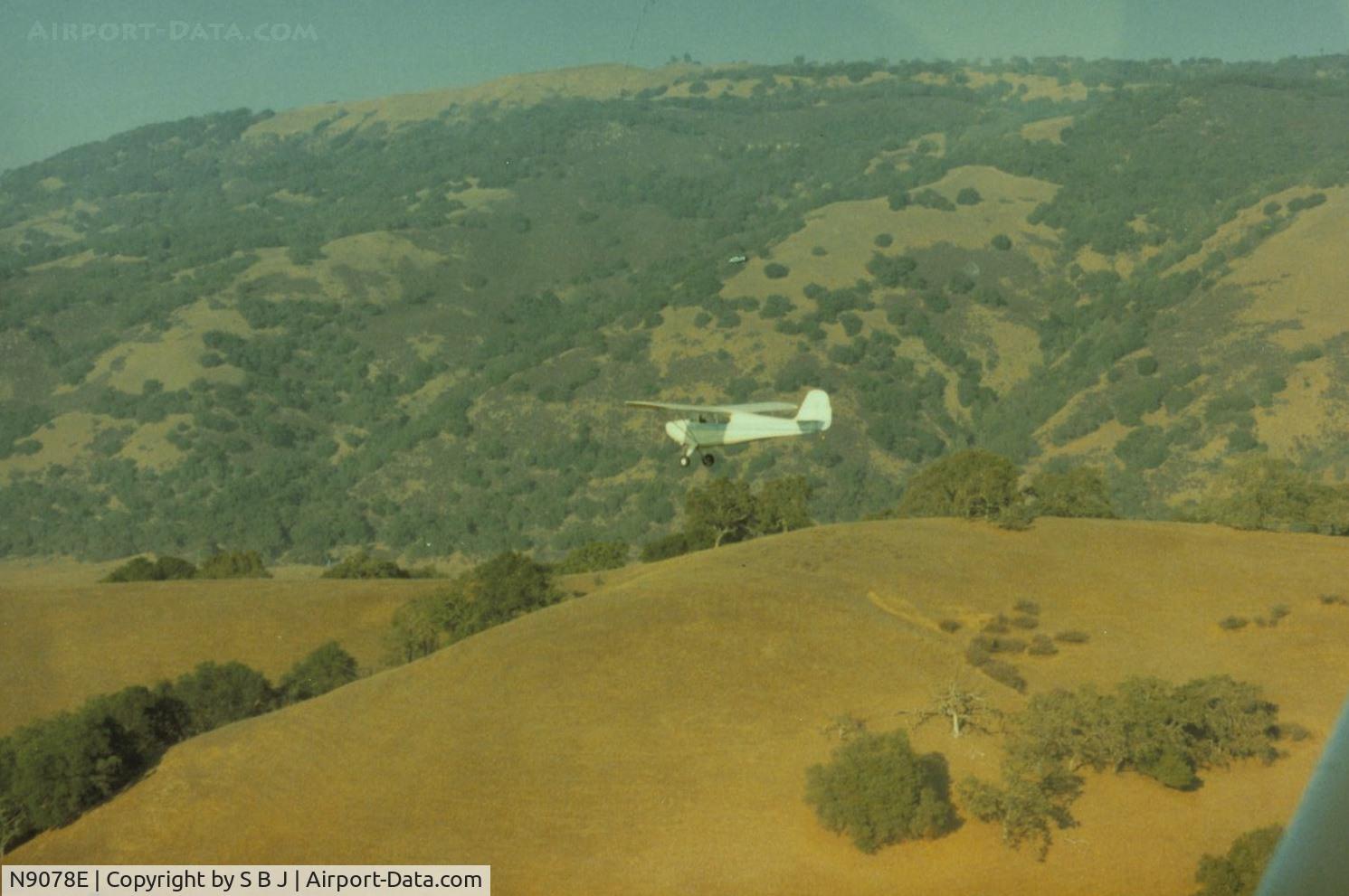 N9078E, 1946 Aeronca 11AC Chief C/N 11AC-710, 78E as it flys  along the Mt Hamilton range on a flight from Watsonville back home to Fremont,Calif.