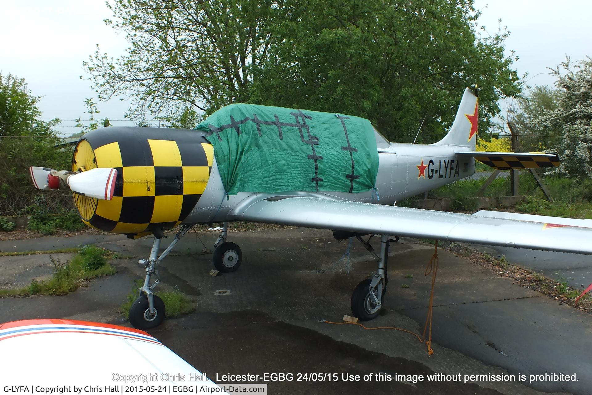 G-LYFA, 1982 Yakovlev Yak-52 C/N 822608, parked at Leicester