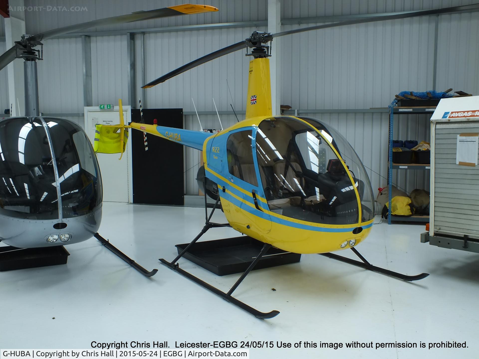 G-HUBA, 1986 Robinson R22 Beta C/N 0608, inside the Flyheli hangar