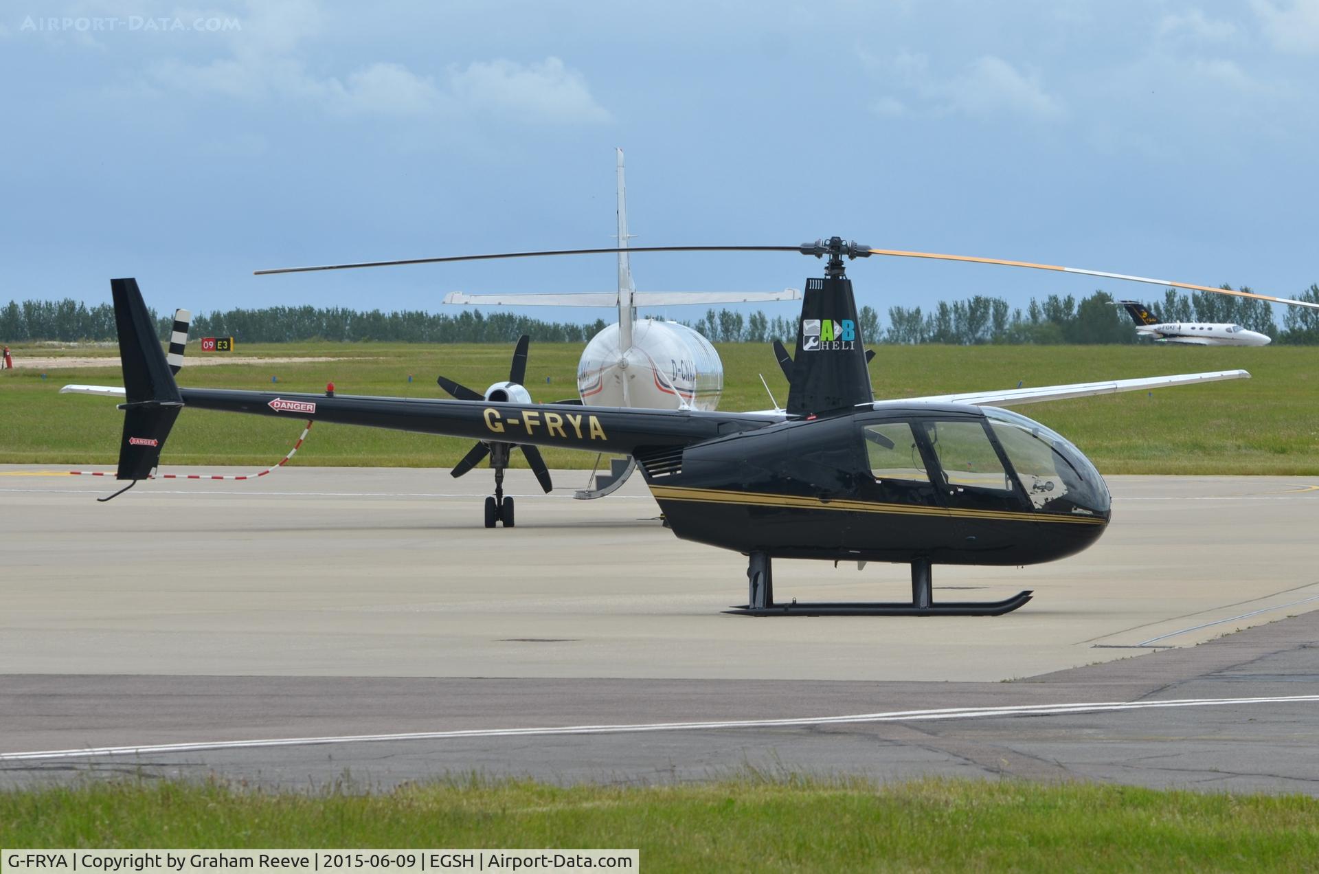 G-FRYA, 2006 Robinson R44 Raven II C/N 11605, Parked at Norwich.