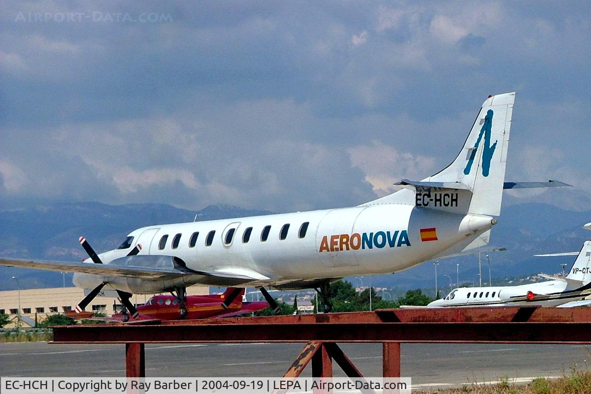 EC-HCH, 1986 Swearingen SA-226T Metro III C/N AC-658B, Fairchild Swearingen SA.227AC Metro III [AC-658B] (Aeronova) Palma De Mallorca~EC 19/09/2004. Yes it has wheels unfortunately the metalwork in the foreground made it impossible to show  and no further angle available.