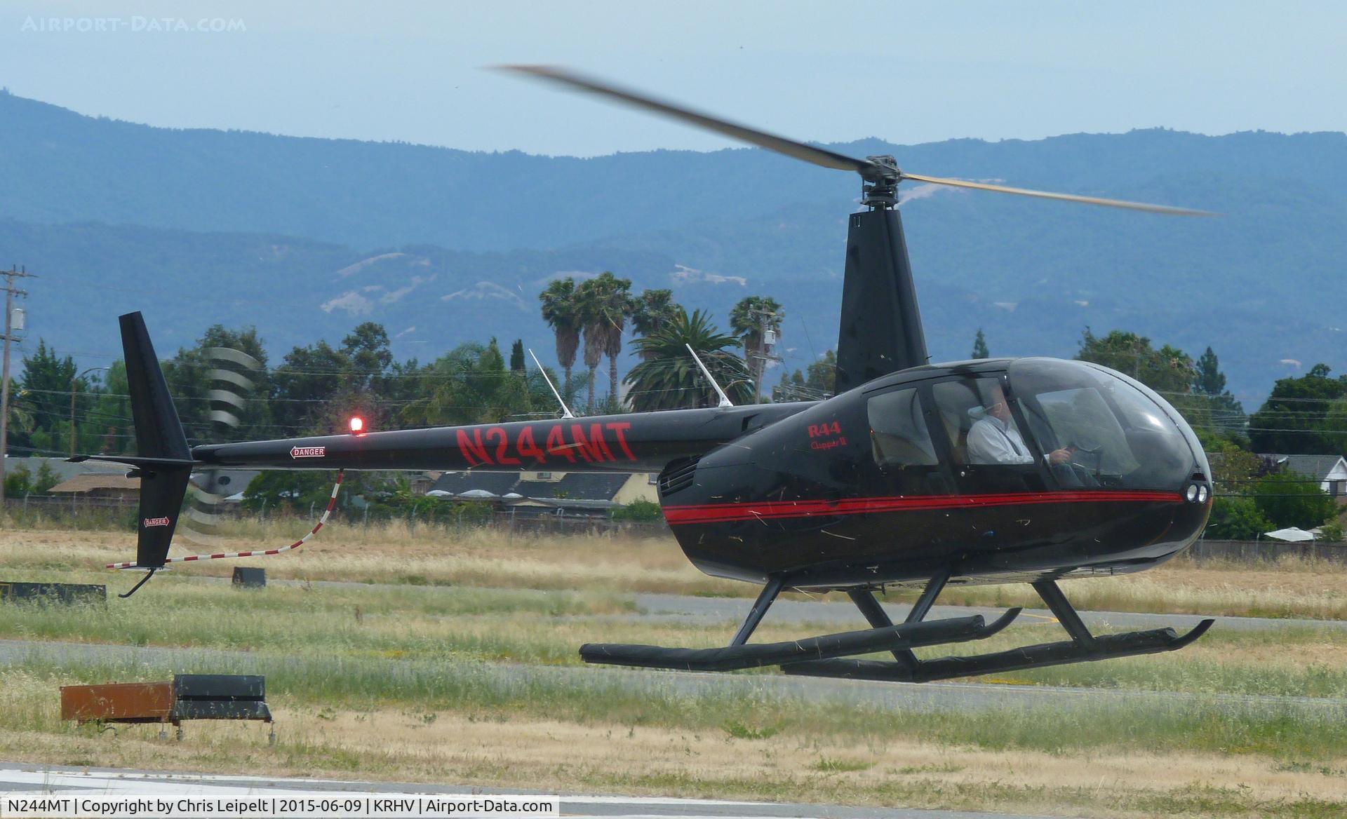 N244MT, 2008 Robinson R44 II C/N 12328, A 2008 Robinson R44 II (N244MT LLC -Saratoga, CA) taxing down Y on a windy and hot June summer day at Reid Hillview Airport, CA. Lots of weeds and brush is being blown around in front of the helicopter!