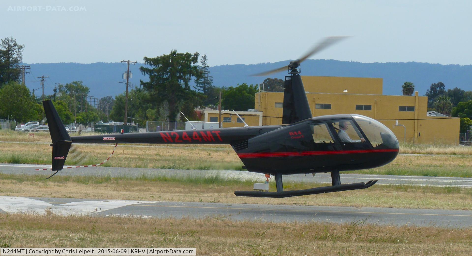 N244MT, 2008 Robinson R44 II C/N 12328, A 2008 Robinson R44 II (N244MT LLC -Saratoga, CA) taxing down Y on a windy and hot June summer day at Reid Hillview Airport, CA. Lots of weeds and brush is being blown around in front of the helicopter from the prop!