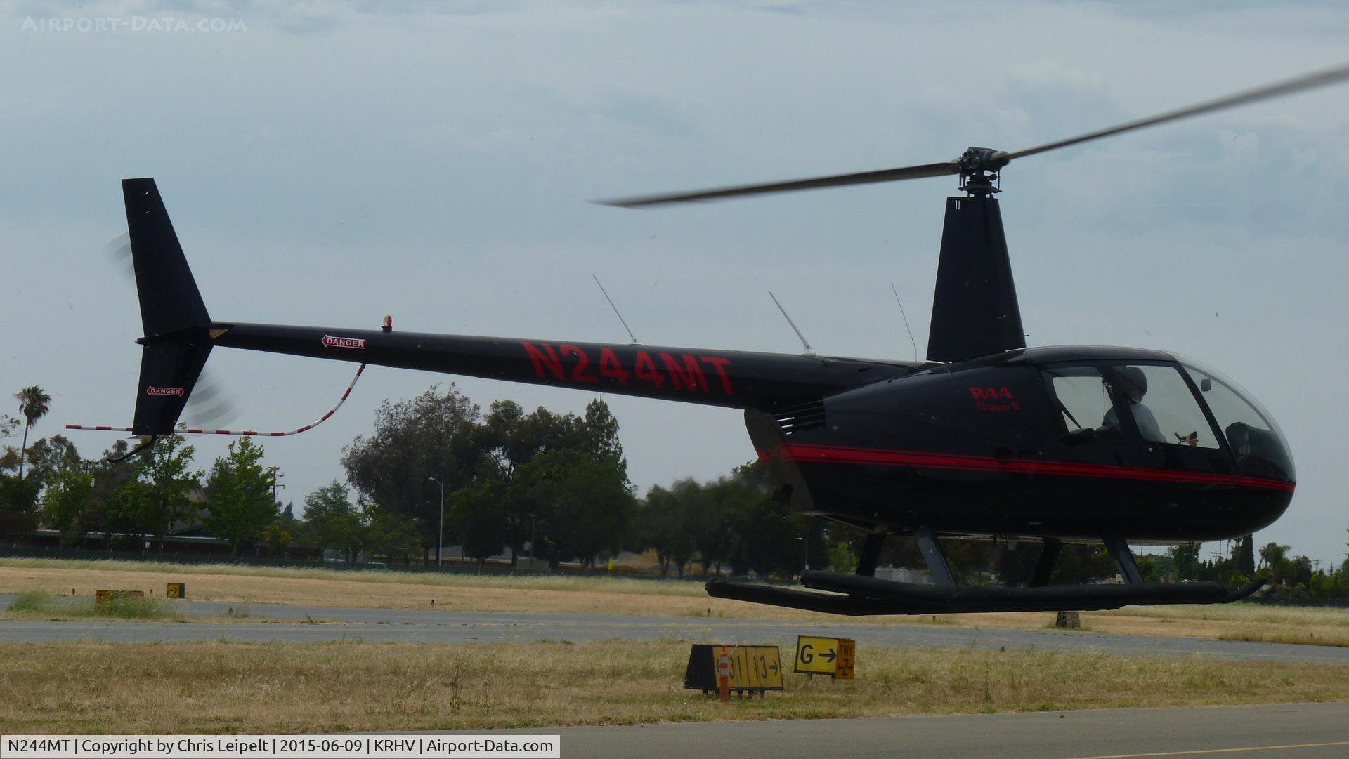 N244MT, 2008 Robinson R44 II C/N 12328, A 2008 Robinson R44 II (N244MT LLC -Saratoga, CA) taxing right in front of me on a windy and hot June summer day at Reid Hillview Airport, CA. It was visiting for maintenance.