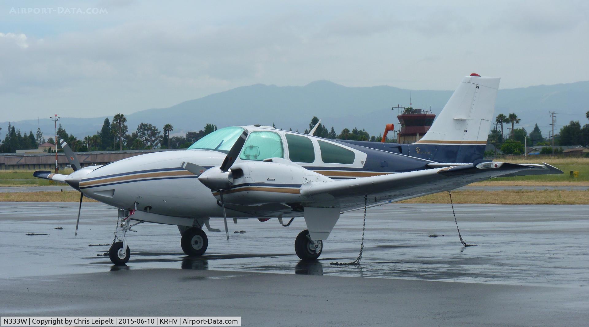 N333W, 1979 Beech E-55 Baron C/N TE-1172, A transient 1979 Beechcraft Baron E-55 (GRECMAR AIR INC - WILMINGTON, DE) sitting at the transient ramp in between rainstorms at Reid Hillview Airport, CA.