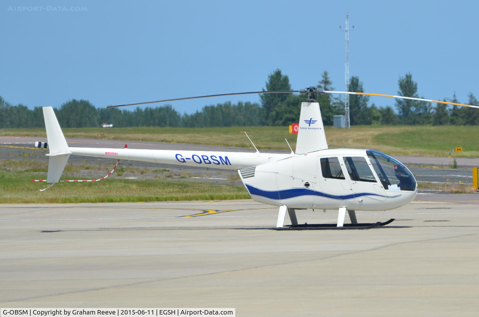 G-OBSM, 2001 Robinson R44 Raven C/N 1030, Parked at Norwich.