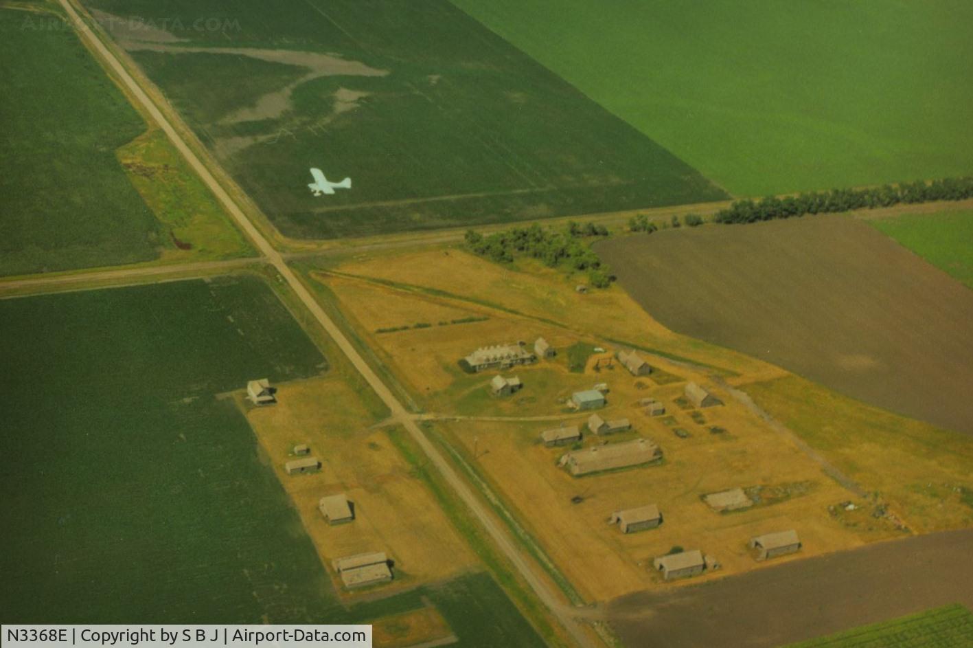 N3368E, 1947 Aeronca 11BC Chief C/N 11BC-1704, 68E as it flys over a farm in the middle of Minnesota.Is that a runway on the farm?