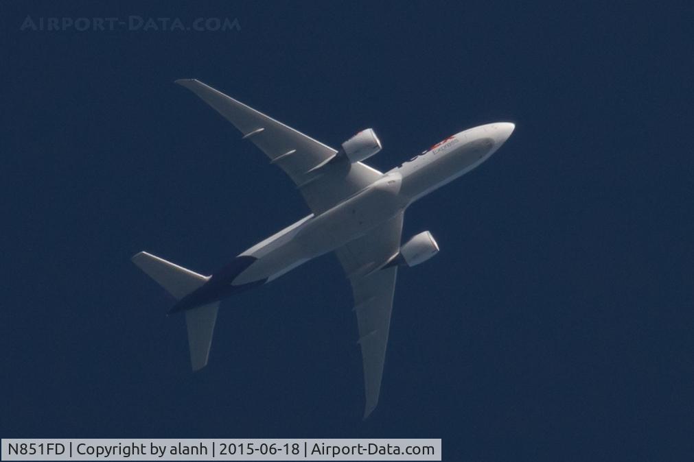 N851FD, 2009 Boeing 777-FS2 C/N 37722, Overflying Guernsey, enroute Paris - Memphis, lit by the evening sun