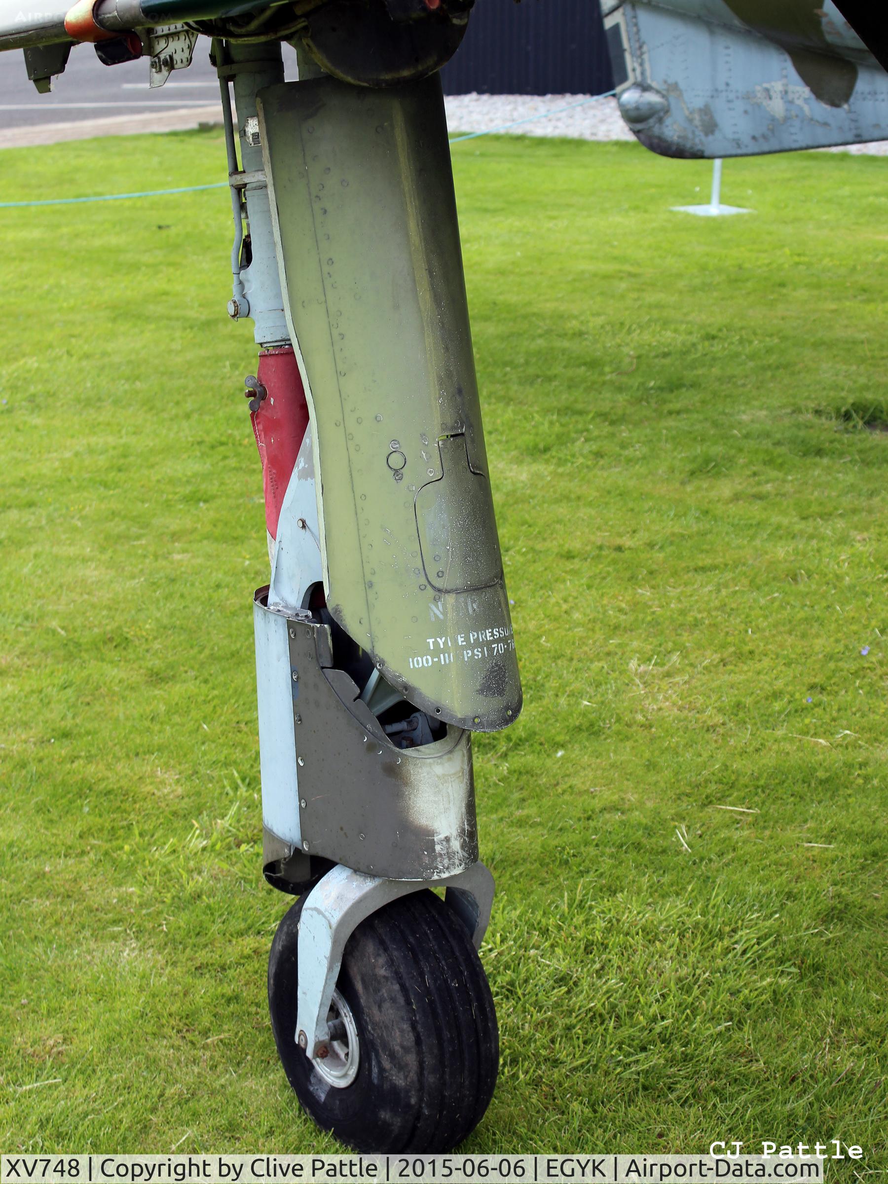 XV748, 1969 Hawker Siddeley Harrier GR.3 C/N 712011, Close up detail starboard undercarriage oleo - On display at the Yorkshire Air Museum, Elvington, Yorks, UK former EGYK