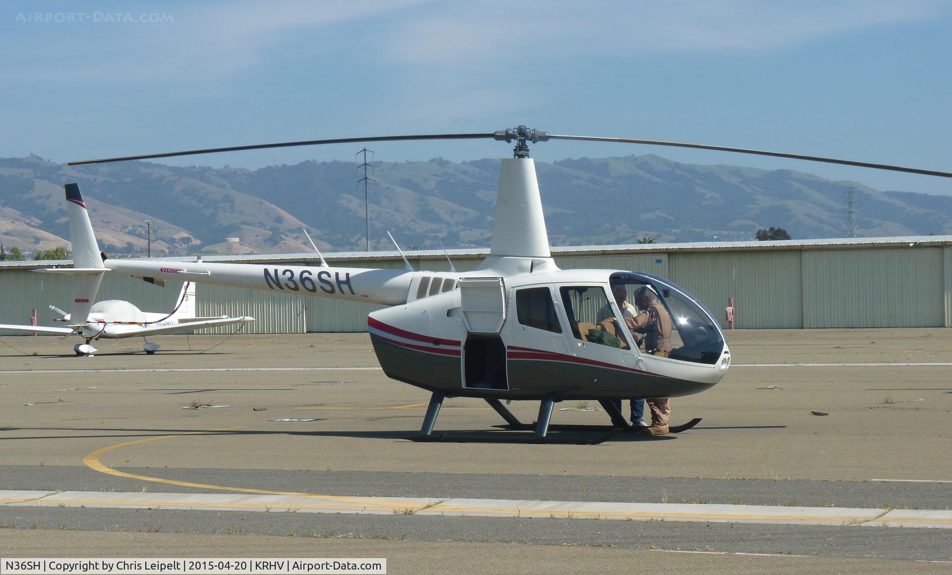 N36SH, 2013 Robinson R66 C/N 0421, A local R44 getting ready to make a vertical takeoff from the south tie downs at Reid Hillview Airport, CA.