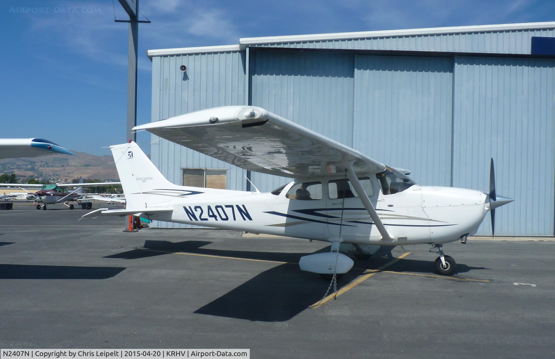 N2407N, 2007 Cessna 172S C/N 172S10550, A transient 2007 Cessna 172S (COGNOSAIR INC - SAN MATEO, CA) parked in front of the Trade Winds hangar at Reid Hillview Airport, CA.