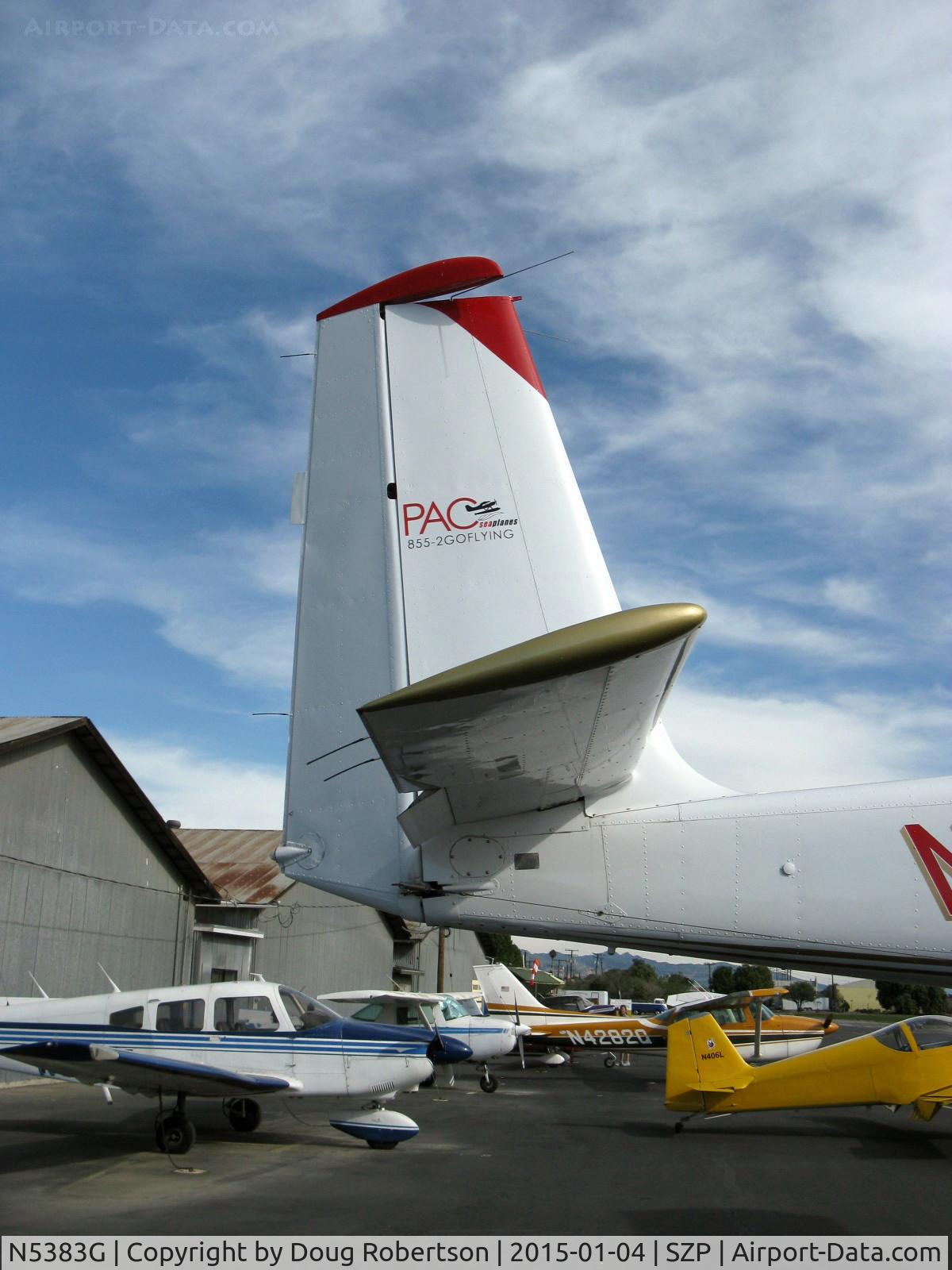N5383G, 1967 Helio H-295/U10D C/N 1249, 1967 Helio HT-295/U-10D SUPER COURIER, Lycoming GO-480 295 Hp, tail logo of operator, Note substantial rudder & vertical stabilizer