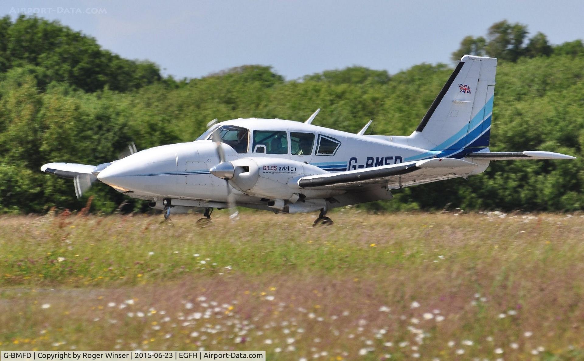 G-BMFD, 1979 Piper PA-23-250 Aztec F C/N 27-7954080, Visiting Piper Aztec camera-ship arriving on Runway 22.Operated by Giles Aviation Ltd.
